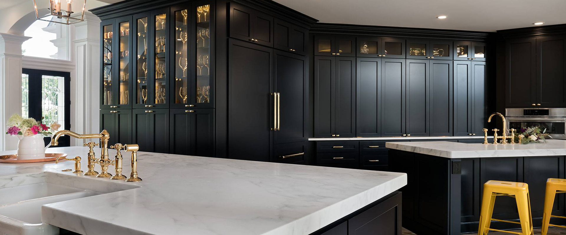 Black cabinets, marble, brass